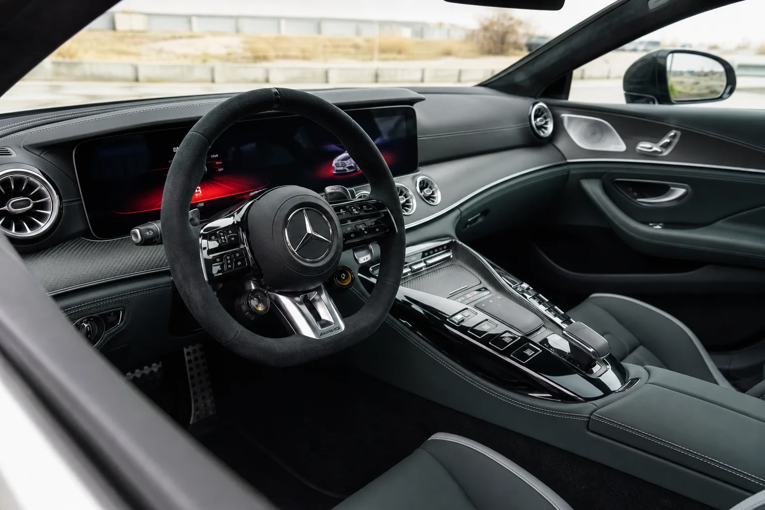 Mercedes AMG GT hire Dubai cabin with AMG wheel and digital cockpit for exotic car rental Dubai evenings