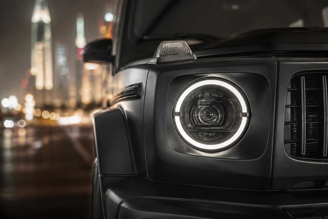 Mercedes-AMG G-Class headlight and grille detail for Mercedes G63 vs Cadillac Escalade Dubai identity