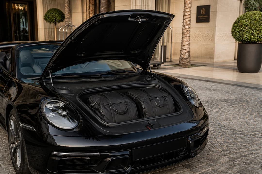 Porsche 911 Carrera Cabriolet front boot with soft weekend bags for luxury car rental Dubai packing limits