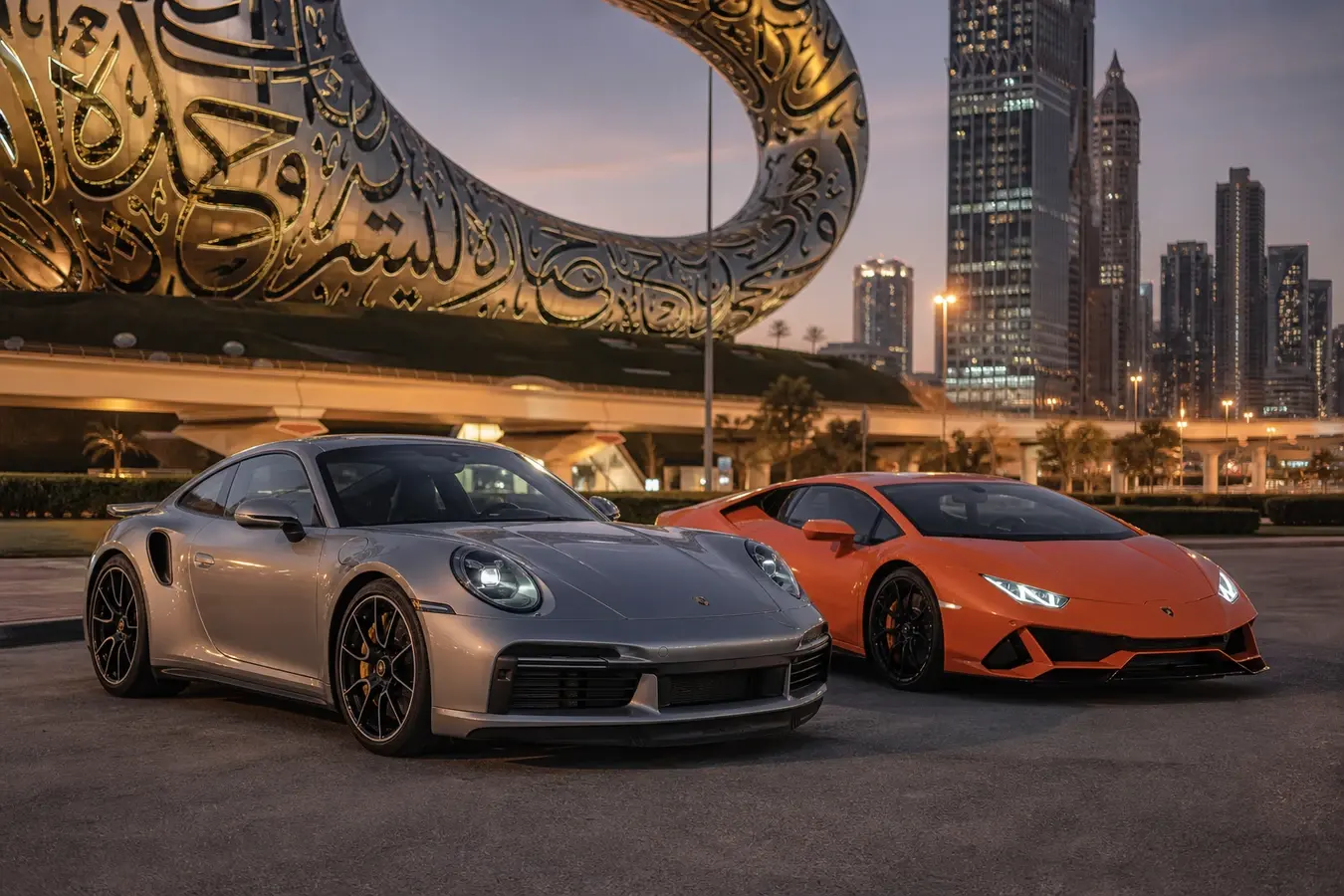 Porsche 911 vs Lamborghini Huracan Dubai hero with a 911 Turbo S and Huracán EVO at Museum of the Future