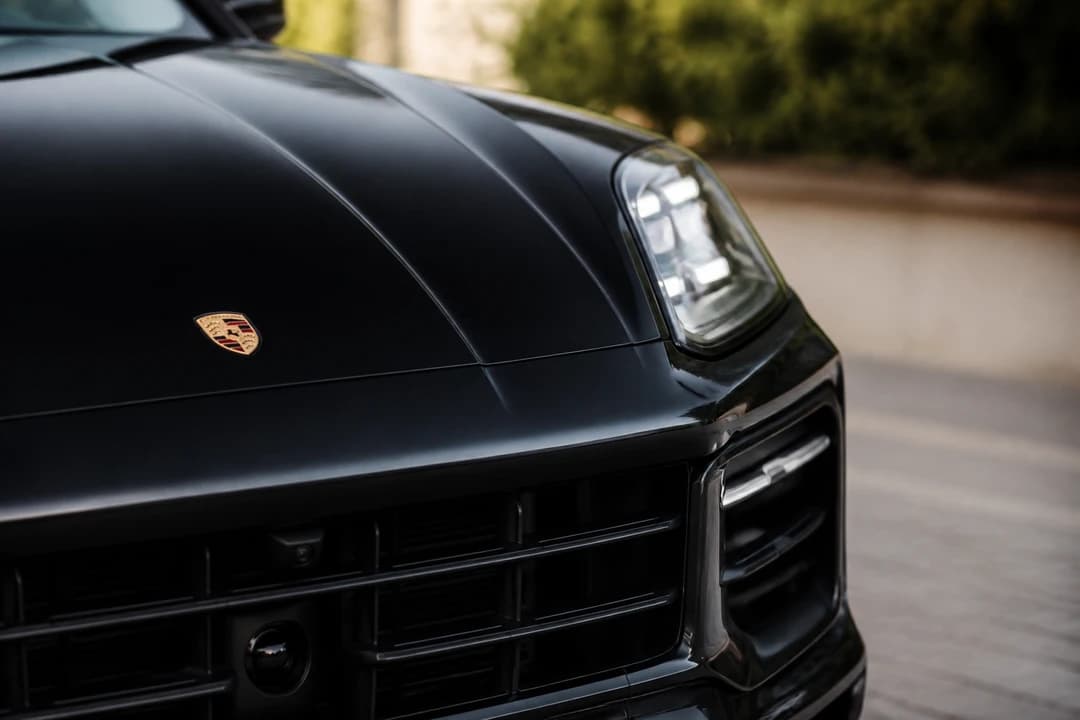 Porsche Cayenne Turbo GT crest and LED headlight detail for Porsche Cayenne rental Dubai identity