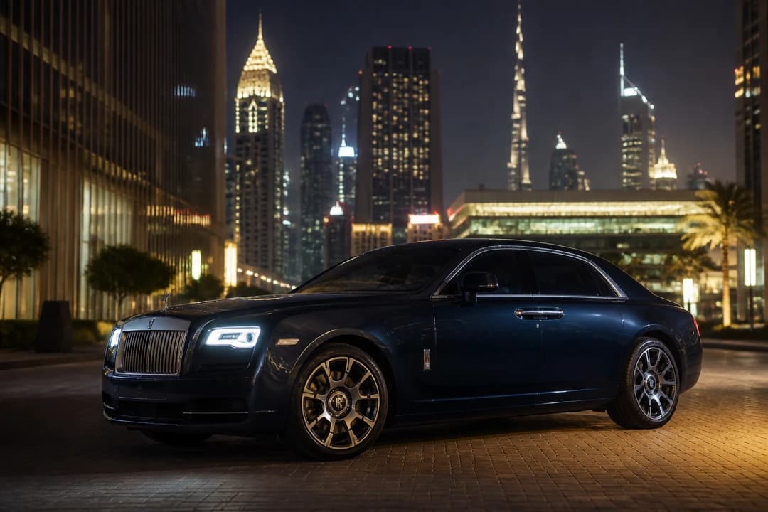 Rolls-Royce Ghost Series II on a DIFC evening street for luxury car comparison Dubai sedan elegance