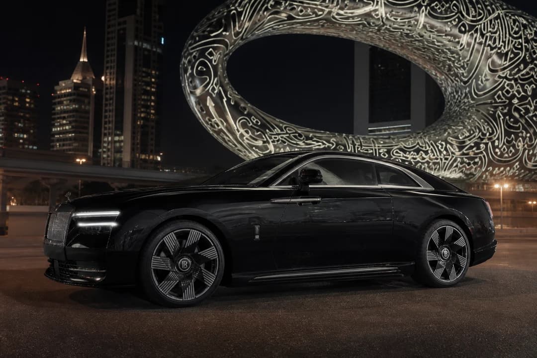 Rent Rolls Royce Dubai: Spectre electric coupe at Museum of the Future at night