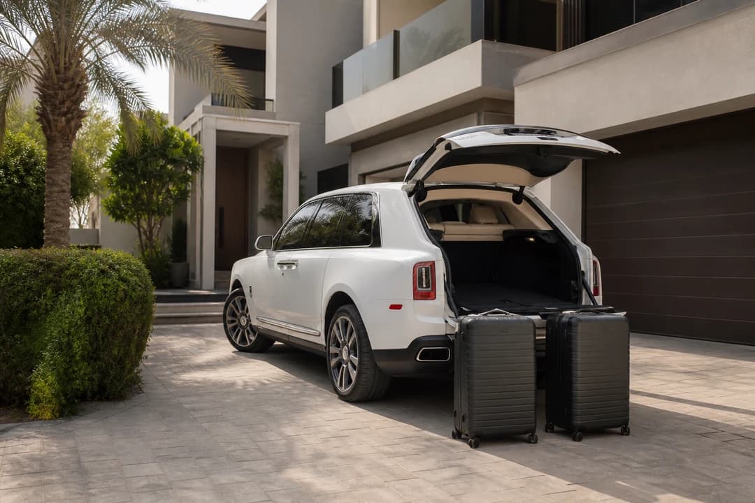 Rolls-Royce Cullinan boot with roller cases at a Dubai villa for luxury car rental Dubai luggage weeks
