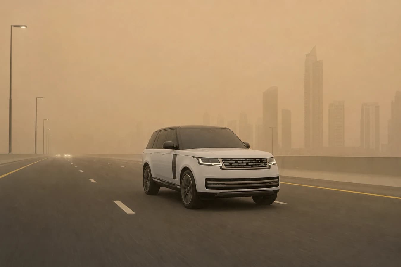 Sandstorm driving Dubai rental car: luxury SUV on a Dubai highway in blowing dust with reduced visibility