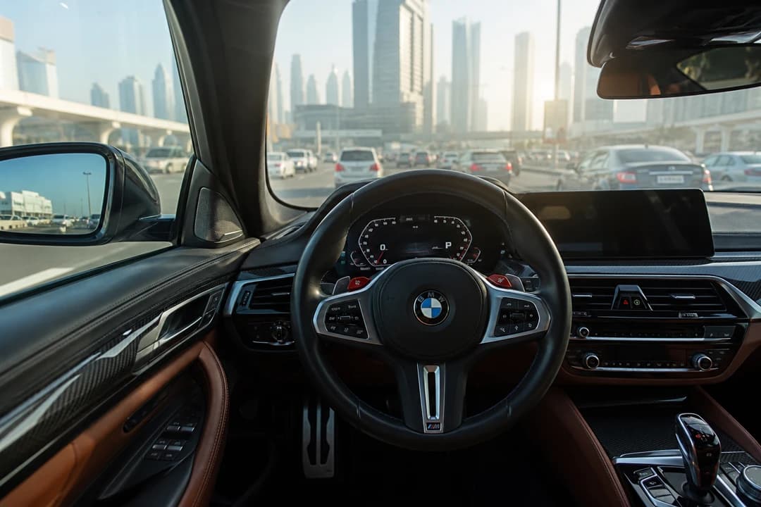 BMW M5 cabin during a luxury car rental Dubai commute on Sheikh Zayed Road