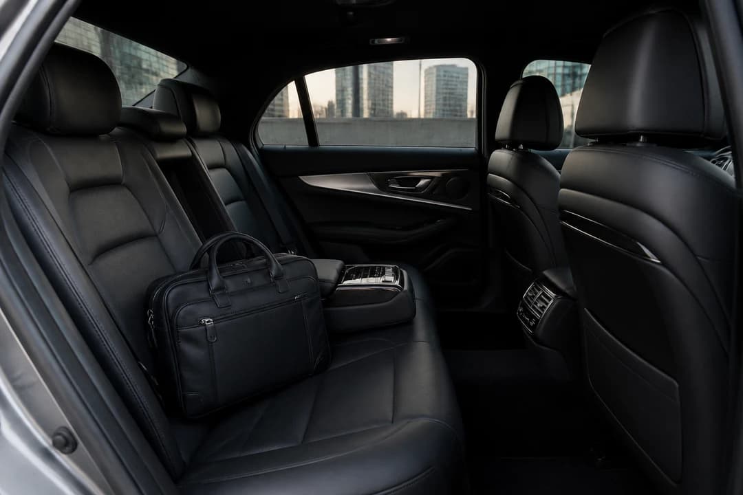 Best luxury car Dubai executive cabin for a month-long business stay with a soft laptop bag