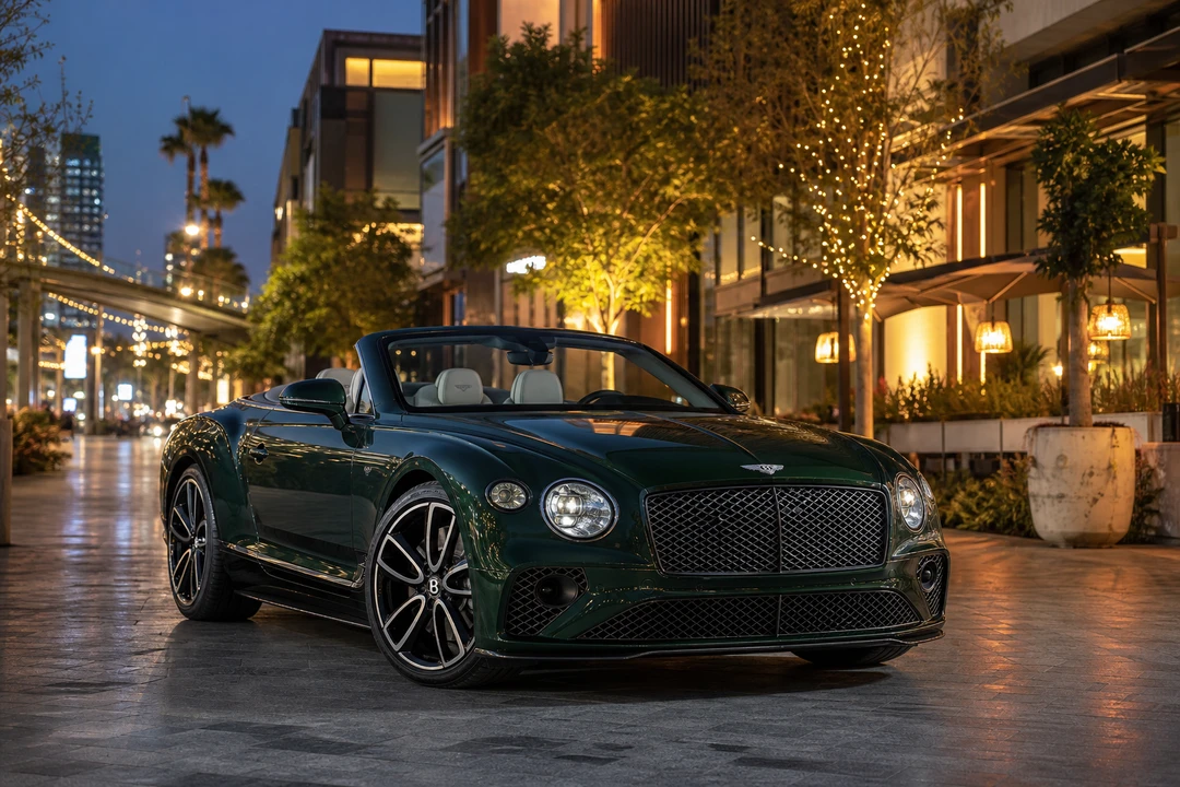 Bentley Continental GTC Speed roof-down at City Walk Dubai evening for exotic car rental Dubai coastal nights
