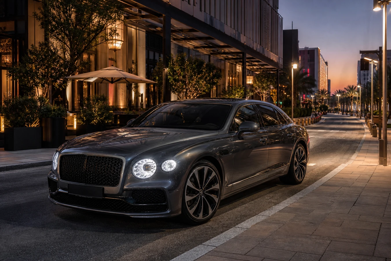 Luxury car rental City Walk Dubai hero with a Bentley Flying Spur on the evening boulevard