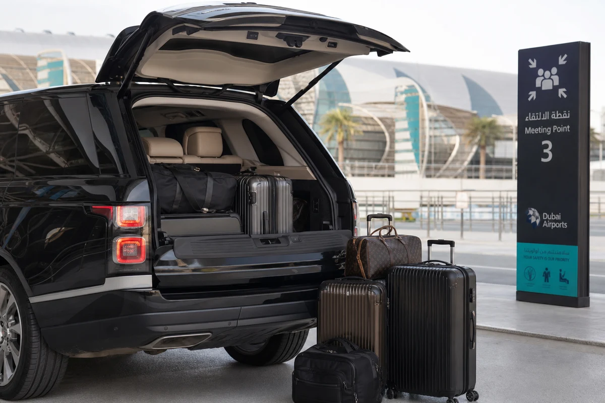 Airport SUV rental Dubai with luggage load at DXB meeting point for family arrival plans