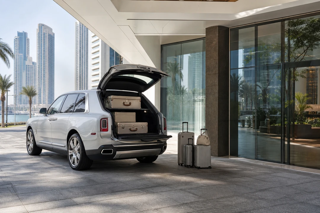 Luxury SUV Creek Harbour tower arrival with Cullinan luggage at a residential porte-cochere