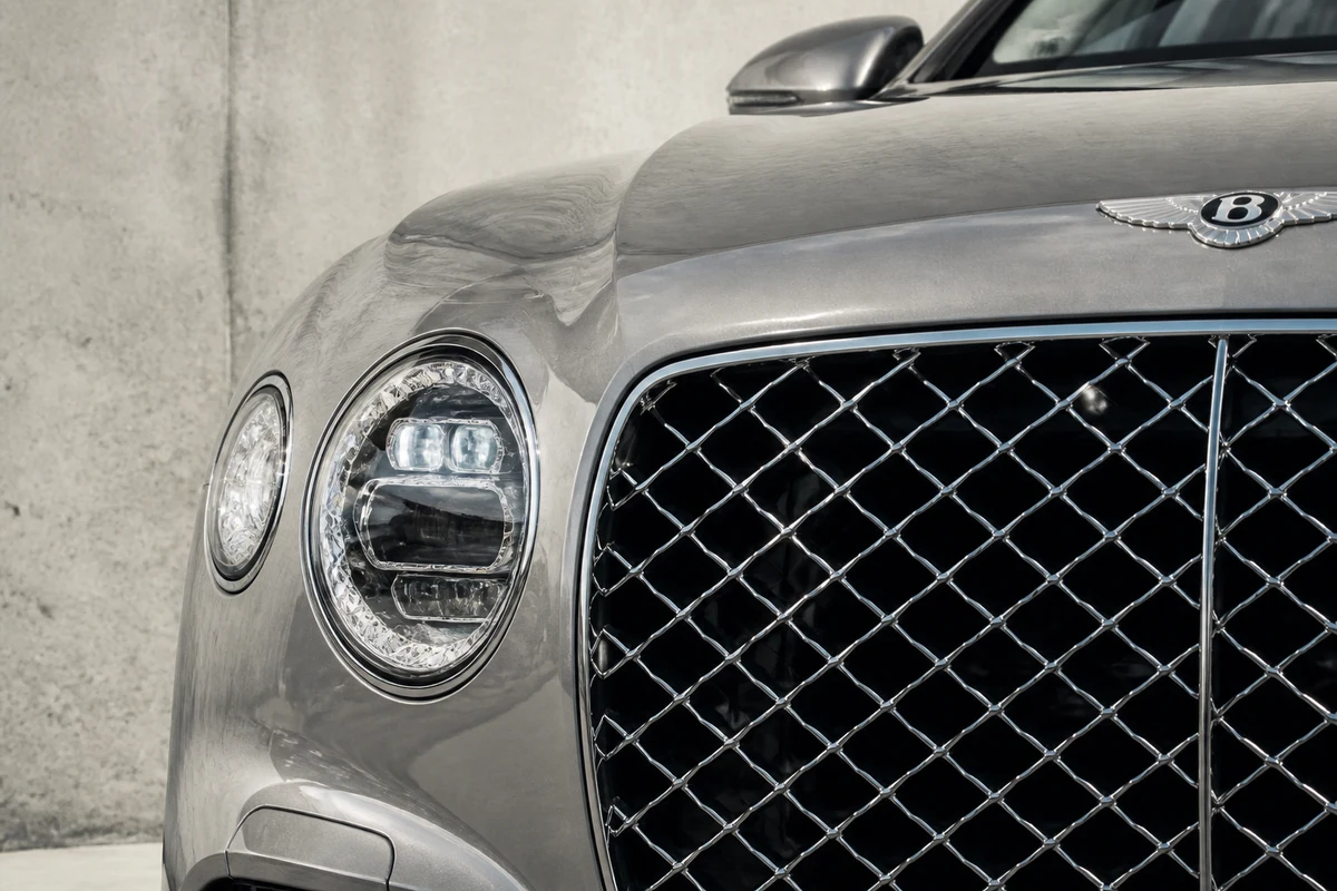 Bentley Flying Spur grille against d3 concrete for luxury car rental Dubai Design District