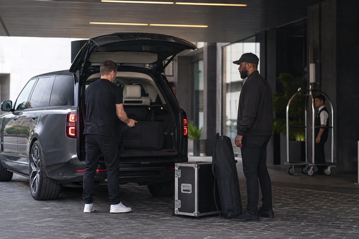 Luxury SUV Dubai car delivery at a d3 loading bay with soft equipment cases