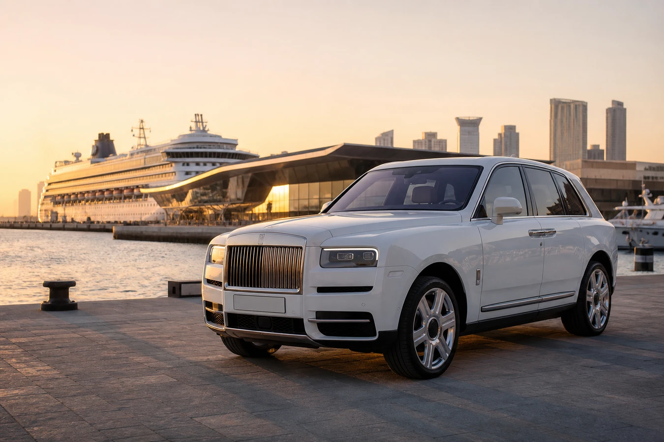 Car rental Dubai Harbour luxury hero with a white Rolls-Royce Cullinan at the cruise terminal waterfront at golden hour