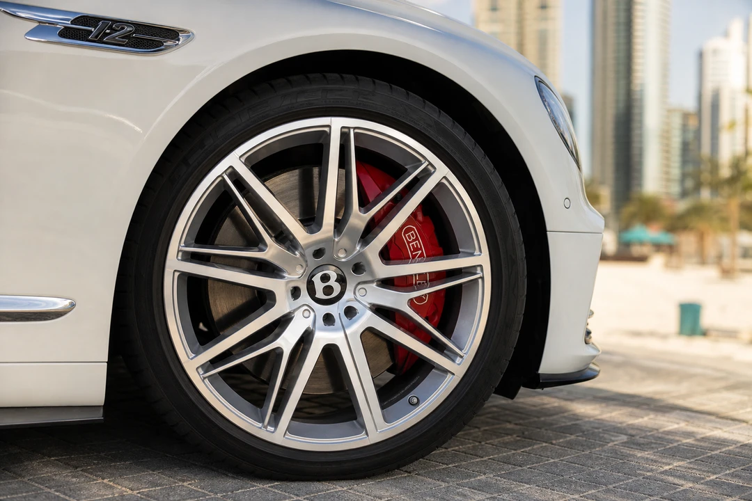 Bentley wheel and brake detail at JBR kerb for luxury beachfront rental decisions
