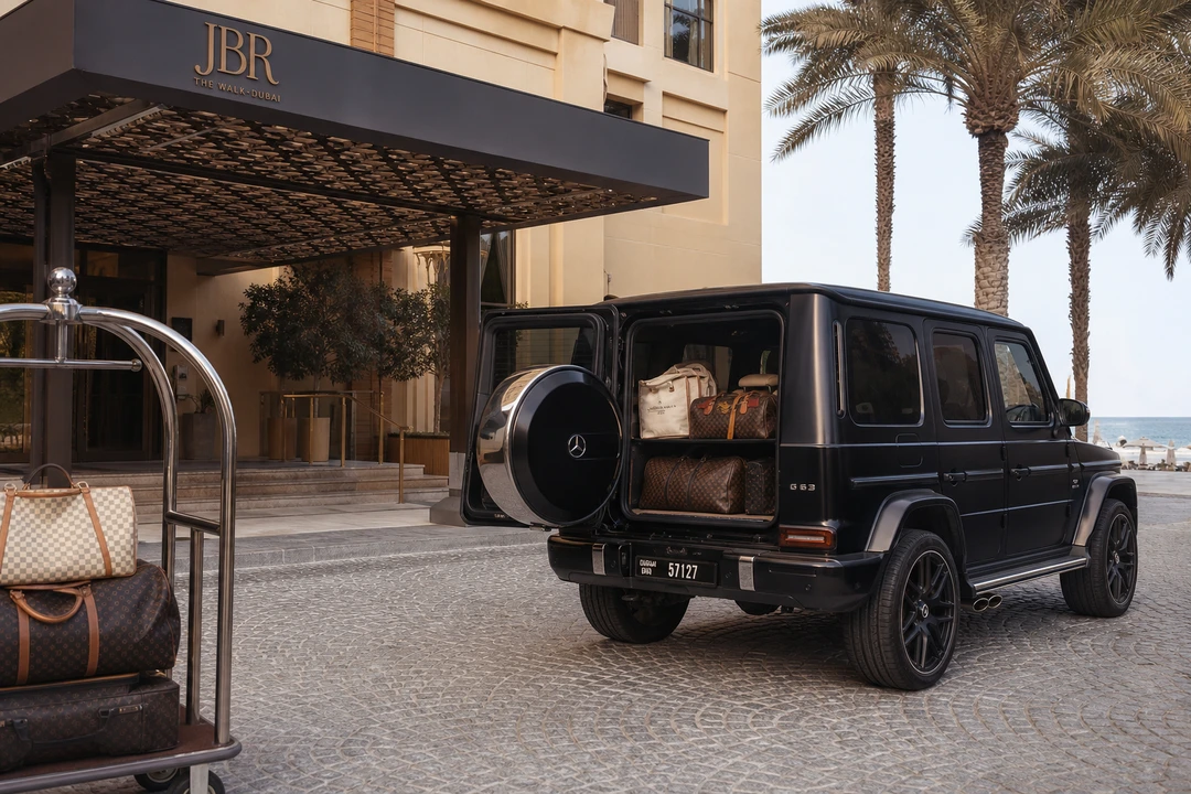 Mercedes-Benz G63 with beach bags and weekend luggage at a JBR hotel handover