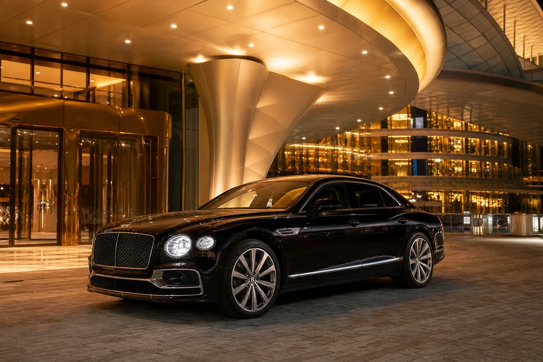 Bentley Flying Spur at The Meydan Hotel porte-cochere during an evening event in Dubai