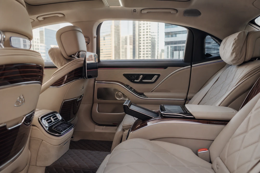 Maybach rear cabin leather seats for executive sedan rental Dubai meeting days