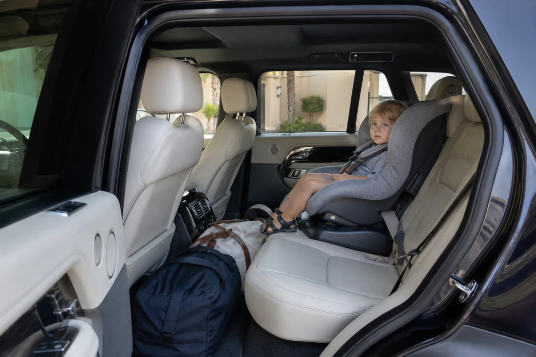 Child seat installed in a luxury SUV rear row for family luxury car rental Dubai school holidays