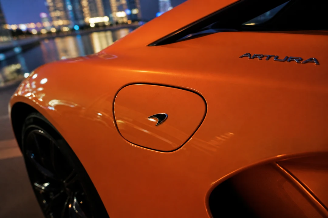 McLaren Artura hybrid charge-port detail for Ferrari 296 GTB vs McLaren Artura Dubai identity
