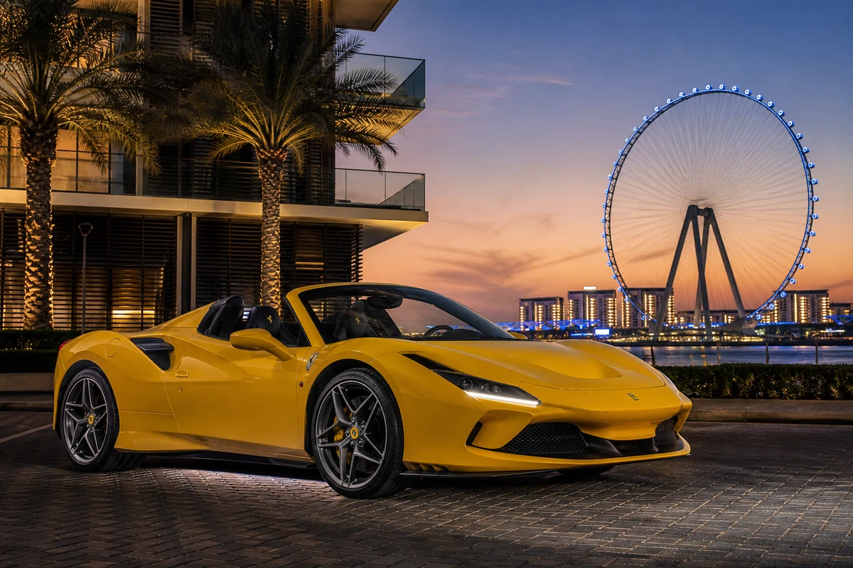 Ferrari F8 Tributo Spider at Bluewaters Island at dusk for luxury car rental Dubai open-roof evenings