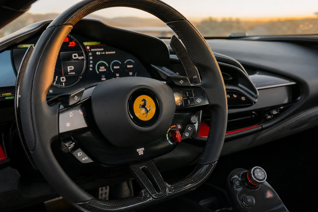Ferrari SF90 steering wheel and hybrid controls for best luxury car Dubai cockpit decisions