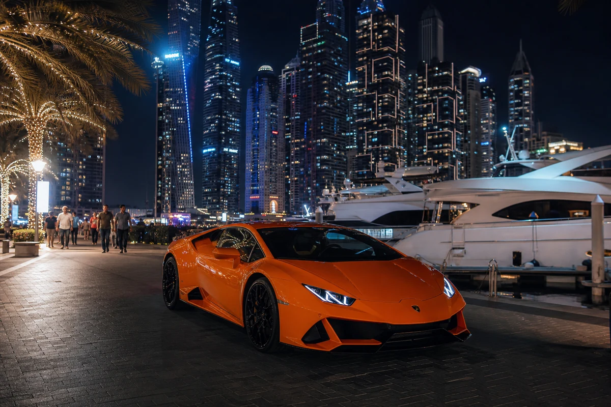 Lamborghini Huracán EVO at Dubai Marina Walk at night for best luxury car Dubai evening plans