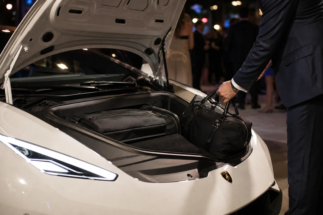 Lamborghini Huracan EVO Coupe front luggage space with evening wear bag for two-seat event trips