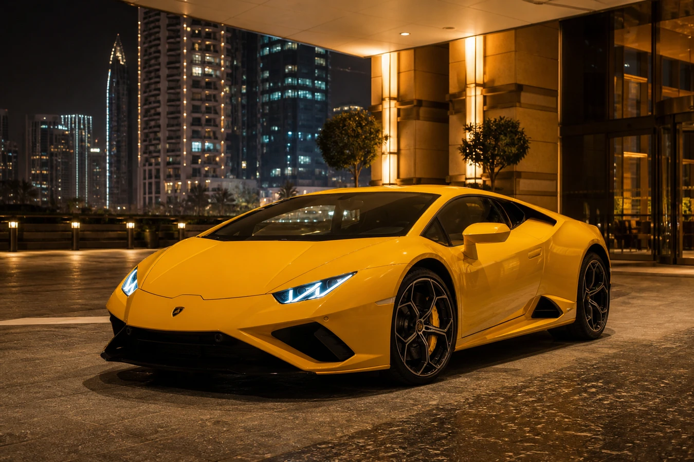 Lamborghini rental Dubai guide hero with a Huracán EVO at a Business Bay hotel at night