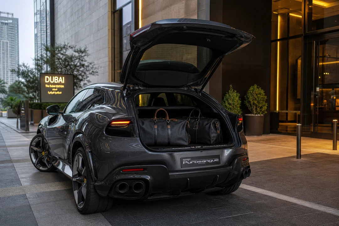 Ferrari Purosangue hatch with soft bags for luxury car hire Dubai packing on a super-SUV week