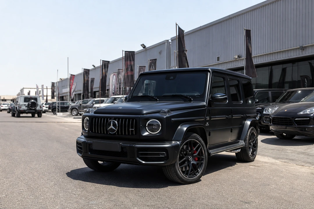 Mercedes-Benz G63 on an Al Quoz showroom street at midday for luxury car rental Dubai business visits