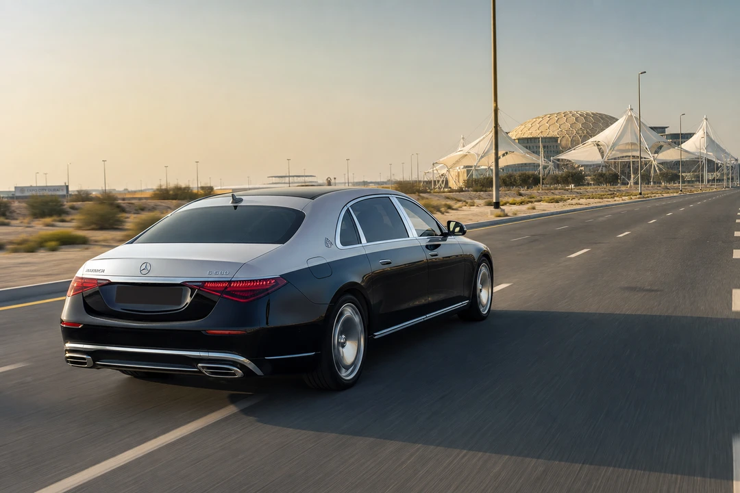 Maybach sedan on a southern Dubai highway toward Expo City for luxury car rental Dubai business trips