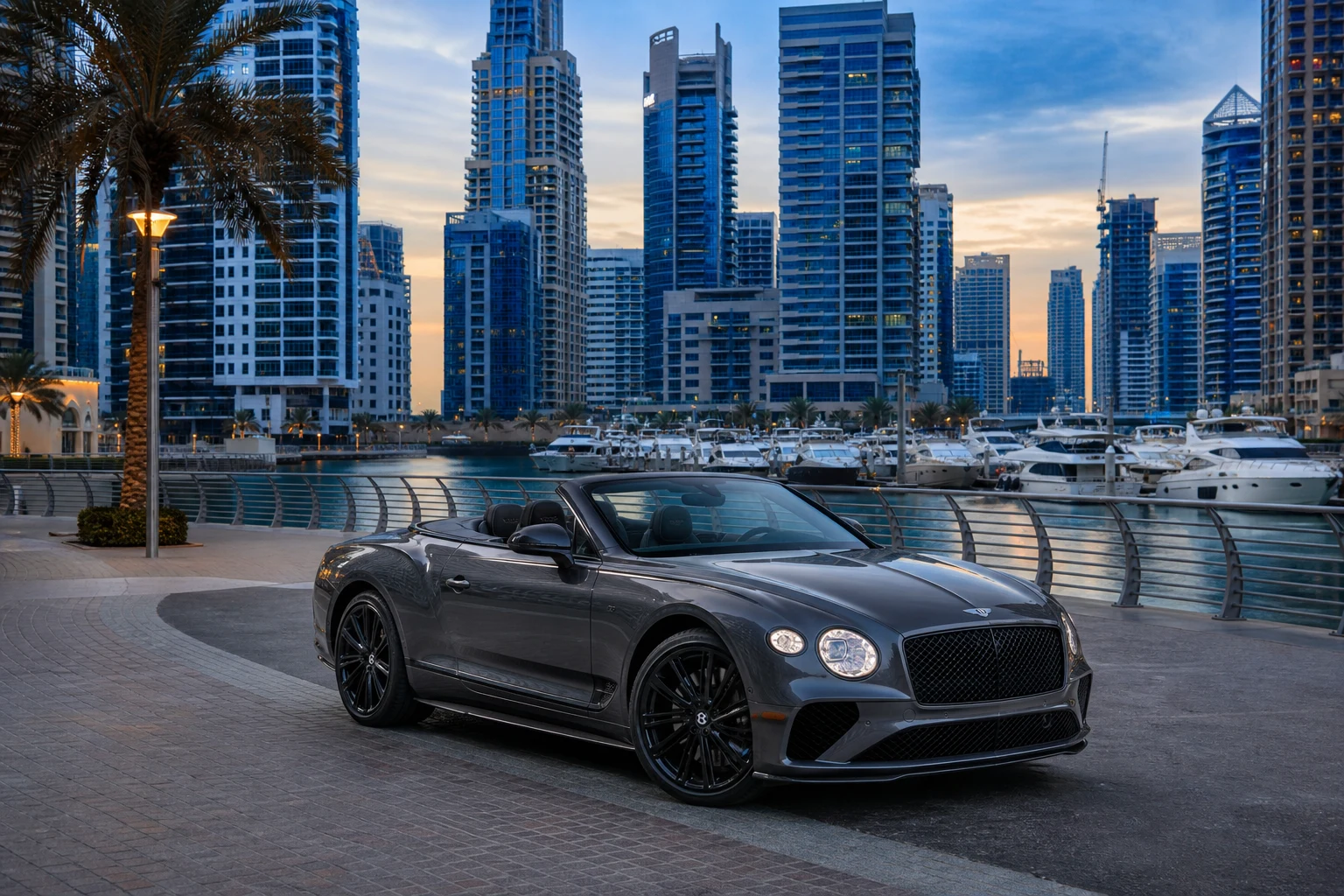 Luxury car rental Dubai winter hero with a Bentley Continental GTC at Dubai Marina Walk in cool blue hour