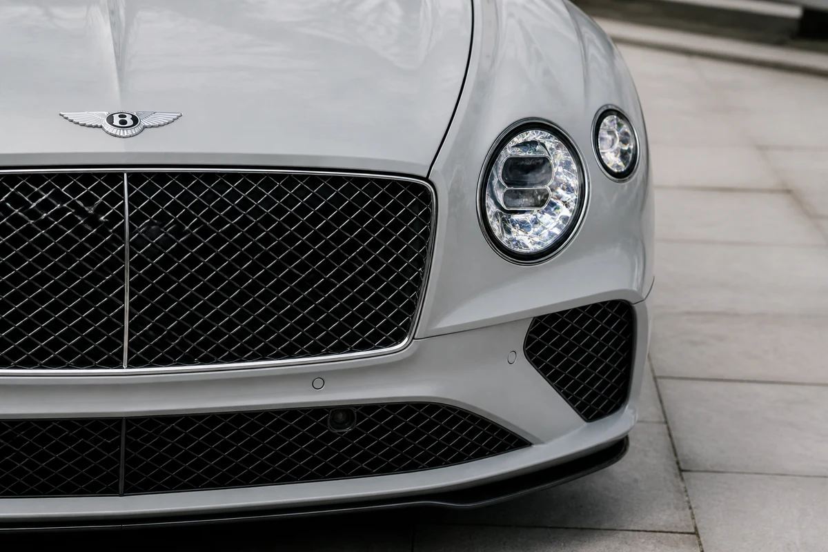 Bentley Continental GT Speed grille detail in cool winter daylight for luxury car rental Dubai