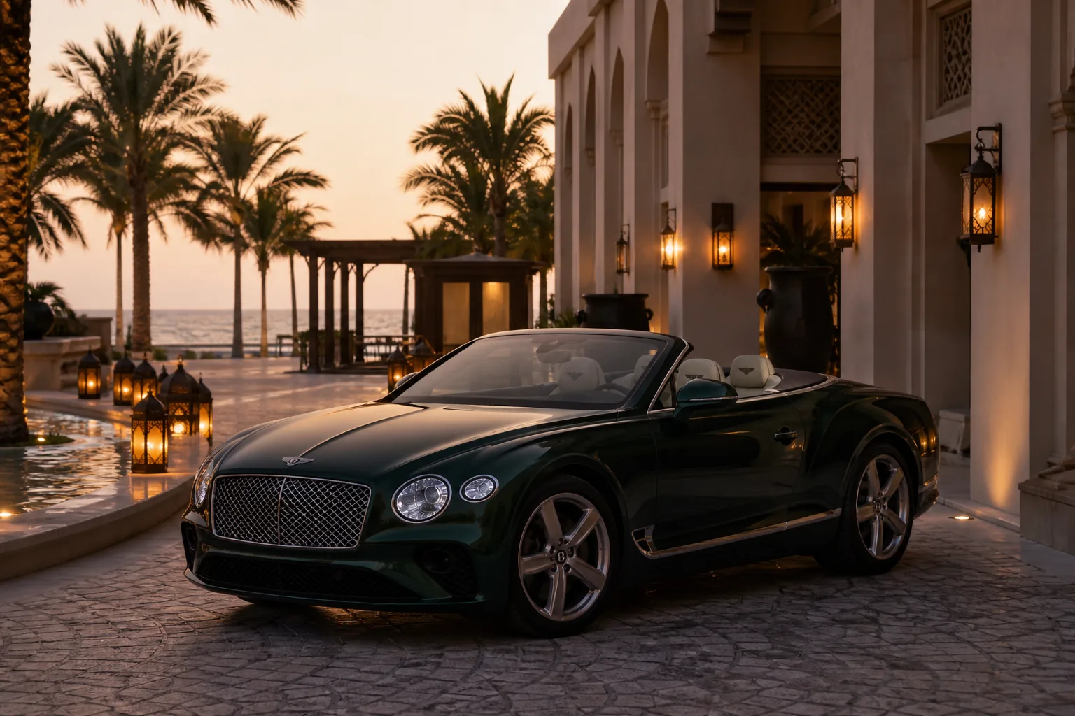 Luxury car rental Jumeirah Dubai hero with a Bentley Continental GTC at a beach hotel driveway