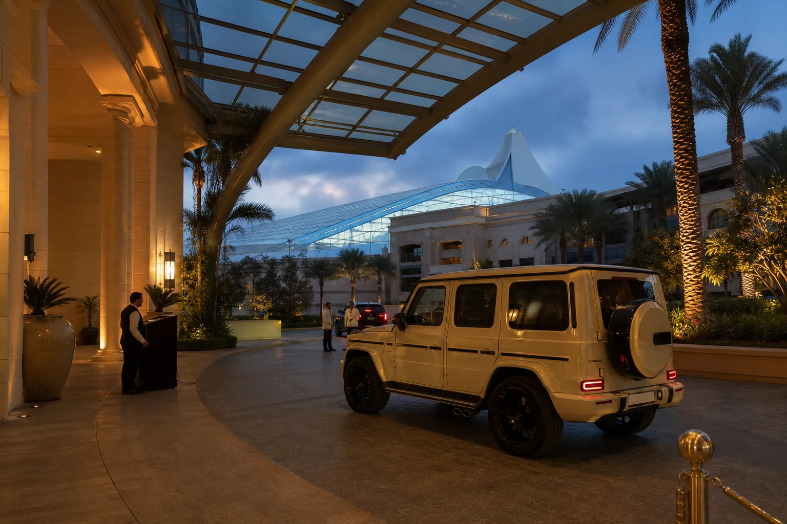 Luxury car rental Mall of the Emirates with a Mercedes-Benz G-Class at a mall hotel at dusk