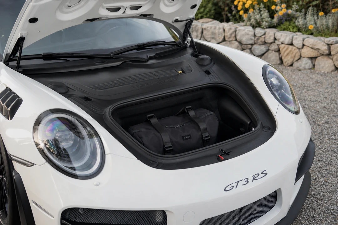 Porsche 911 GT3 RS front luggage space with soft weekend bag for two-seat Dubai trips