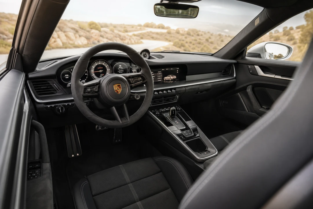 Porsche 911 Turbo S interior leather cabin with digital cluster for everyday supercar rental Dubai comfort