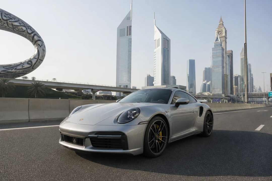 Porsche 911 Turbo S on Sheikh Zayed Road at morning for luxury car comparison Dubai everyday pace