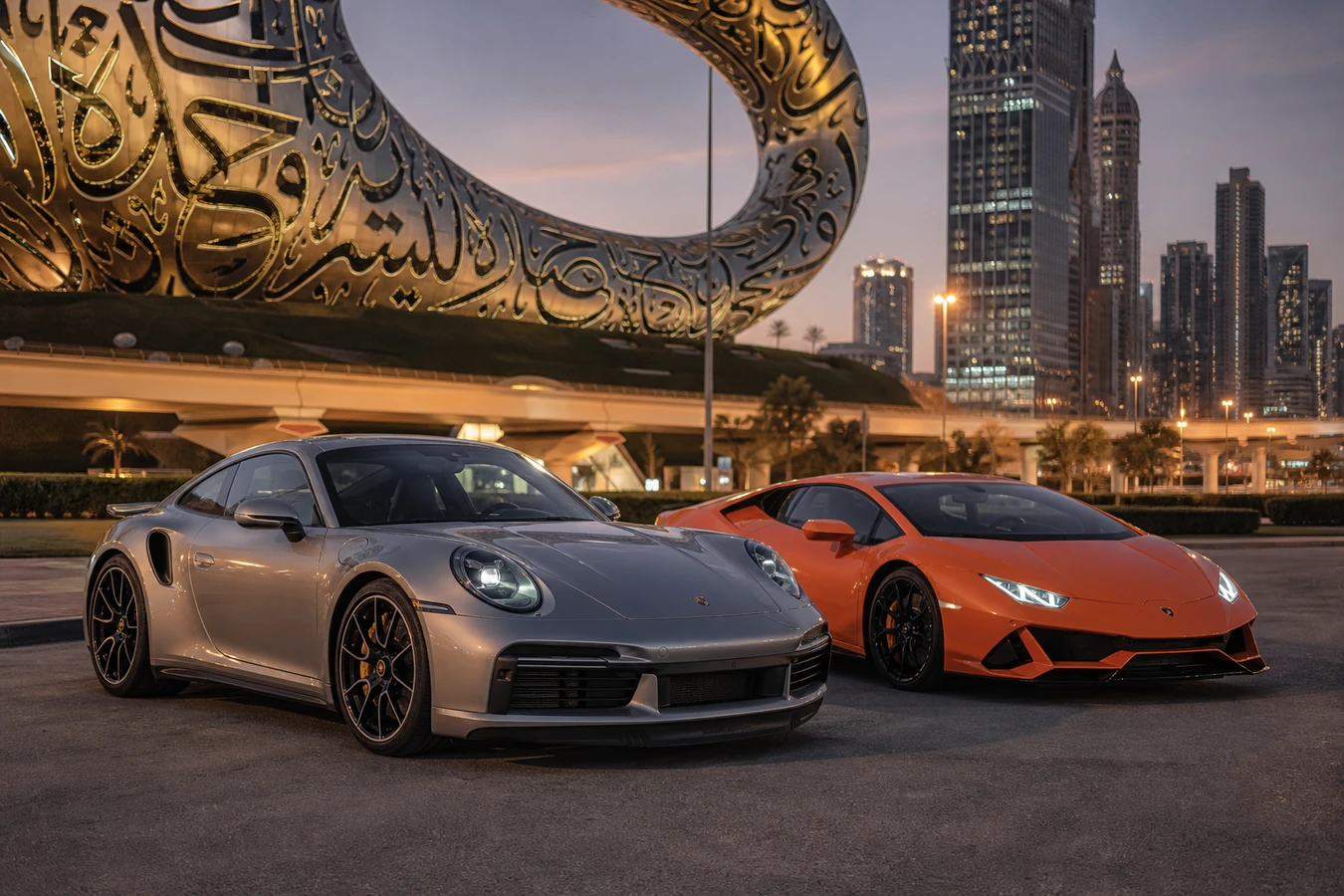 Porsche 911 vs Lamborghini Huracan Dubai hero with a 911 Turbo S and Huracán EVO at Museum of the Future