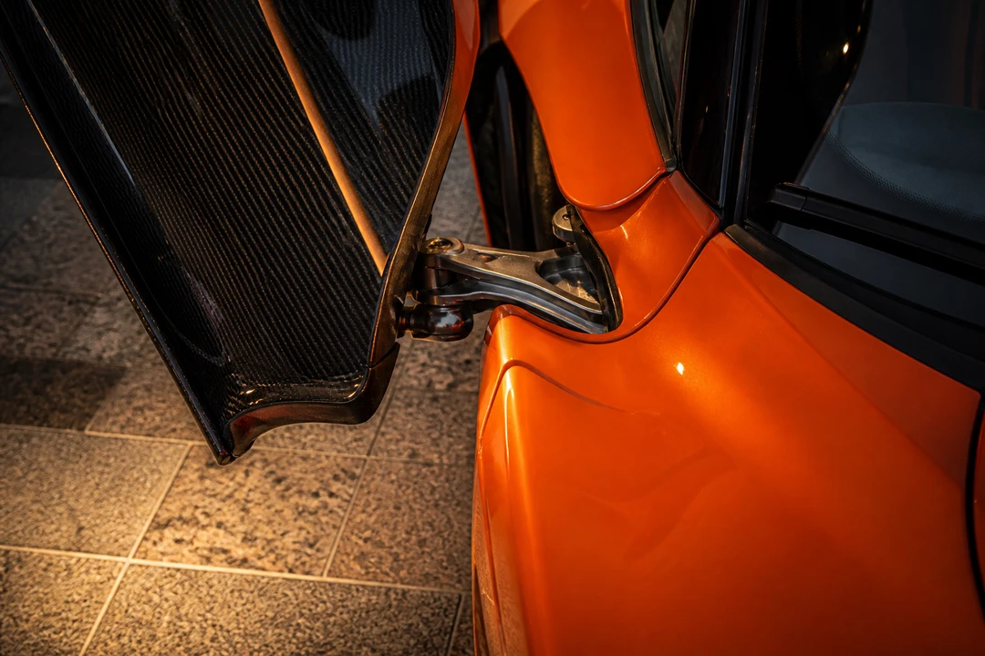 McLaren 720S dihedral door hinge close-up for Porsche 911 vs McLaren 720S Dubai exotic identity
