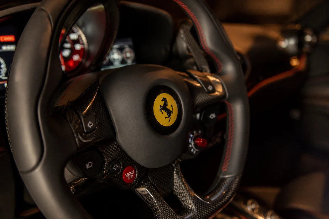 Ferrari F8 Tributo Spider steering wheel detail for proposal car rental Dubai supercar evenings