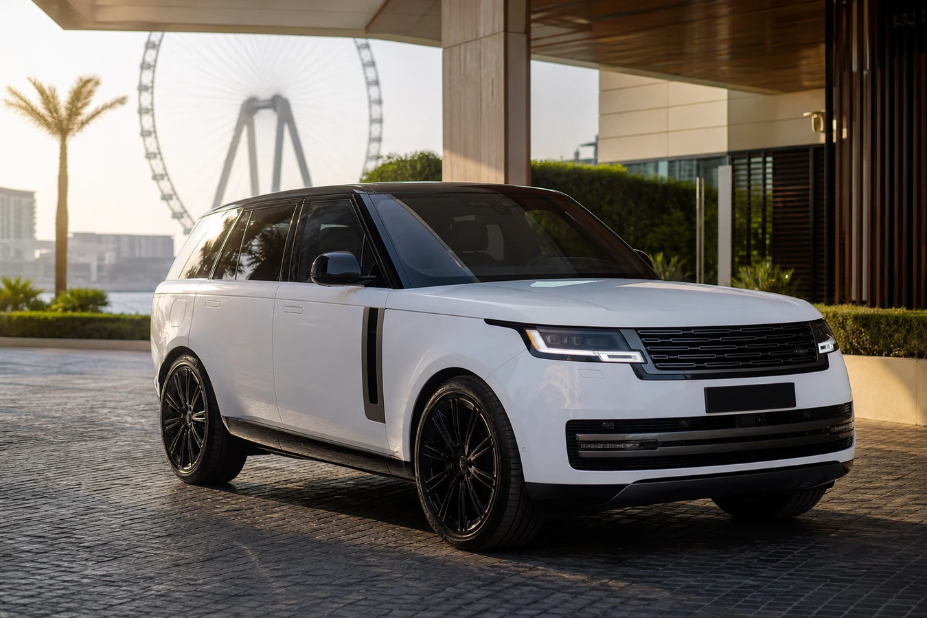 Range Rover rental Dubai guide hero with a white Range Rover Vogue at a Bluewaters hotel driveway