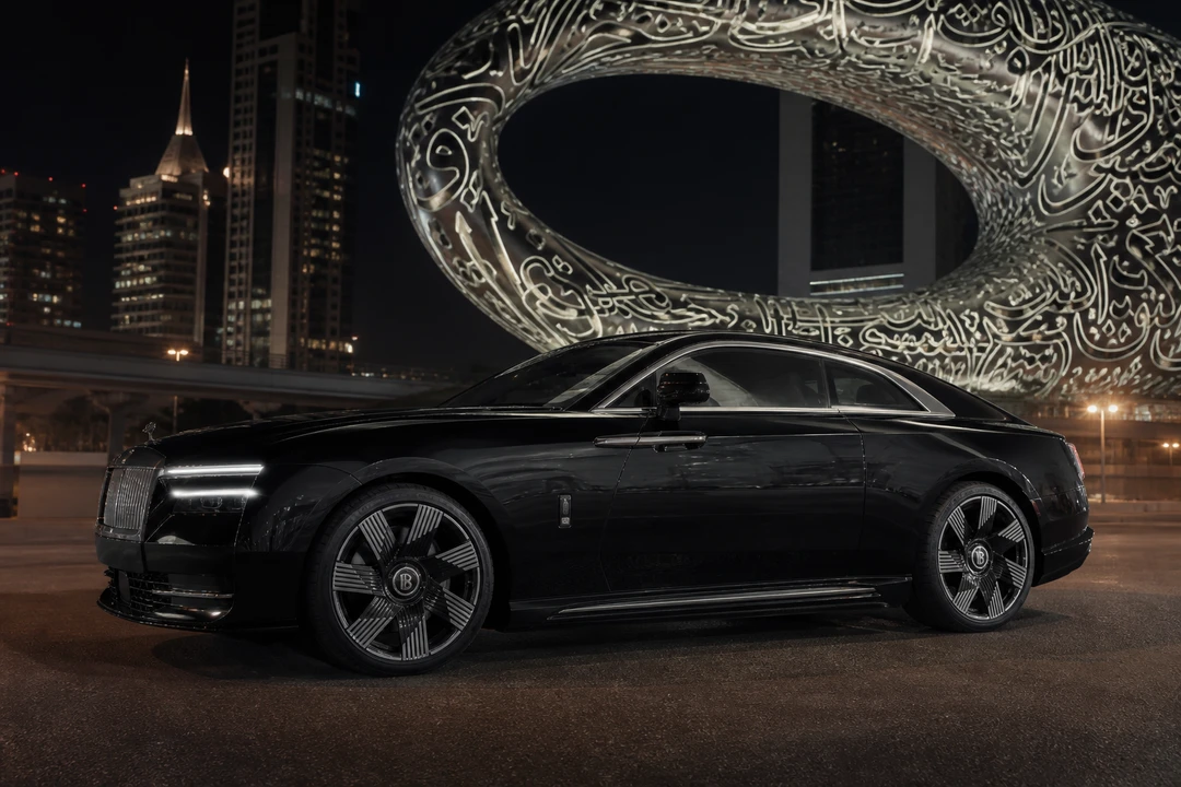 Rent Rolls Royce Dubai: Spectre electric coupe at Museum of the Future at night