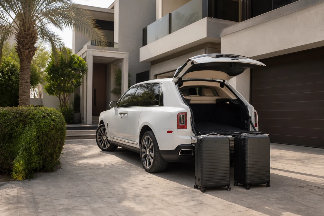 Rolls-Royce Cullinan boot with roller cases at a Dubai villa for luxury car rental Dubai luggage weeks
