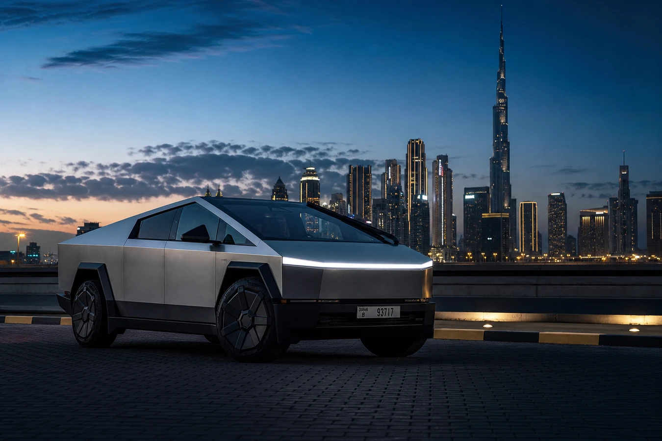 Tesla Cybertruck rental Dubai hero shot at blue-hour with Burj Khalifa skyline and stainless-steel body catching dusk light