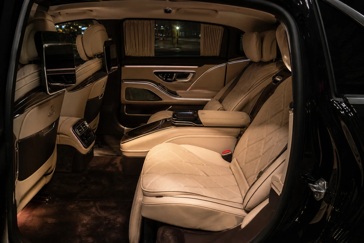 Mercedes-Maybach cabin at night for discreet VIP hotel arrivals in Dubai