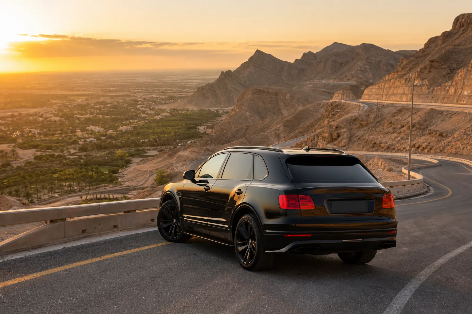 Bentley SUV on Jebel Hafeet mountain road in Al Ain garden city